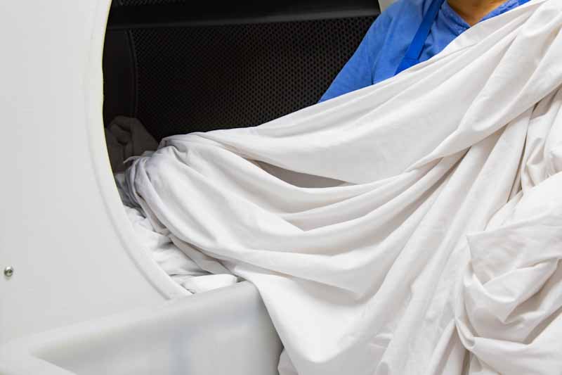 After Cleaning Bed Sheets Prepare for Drying Process