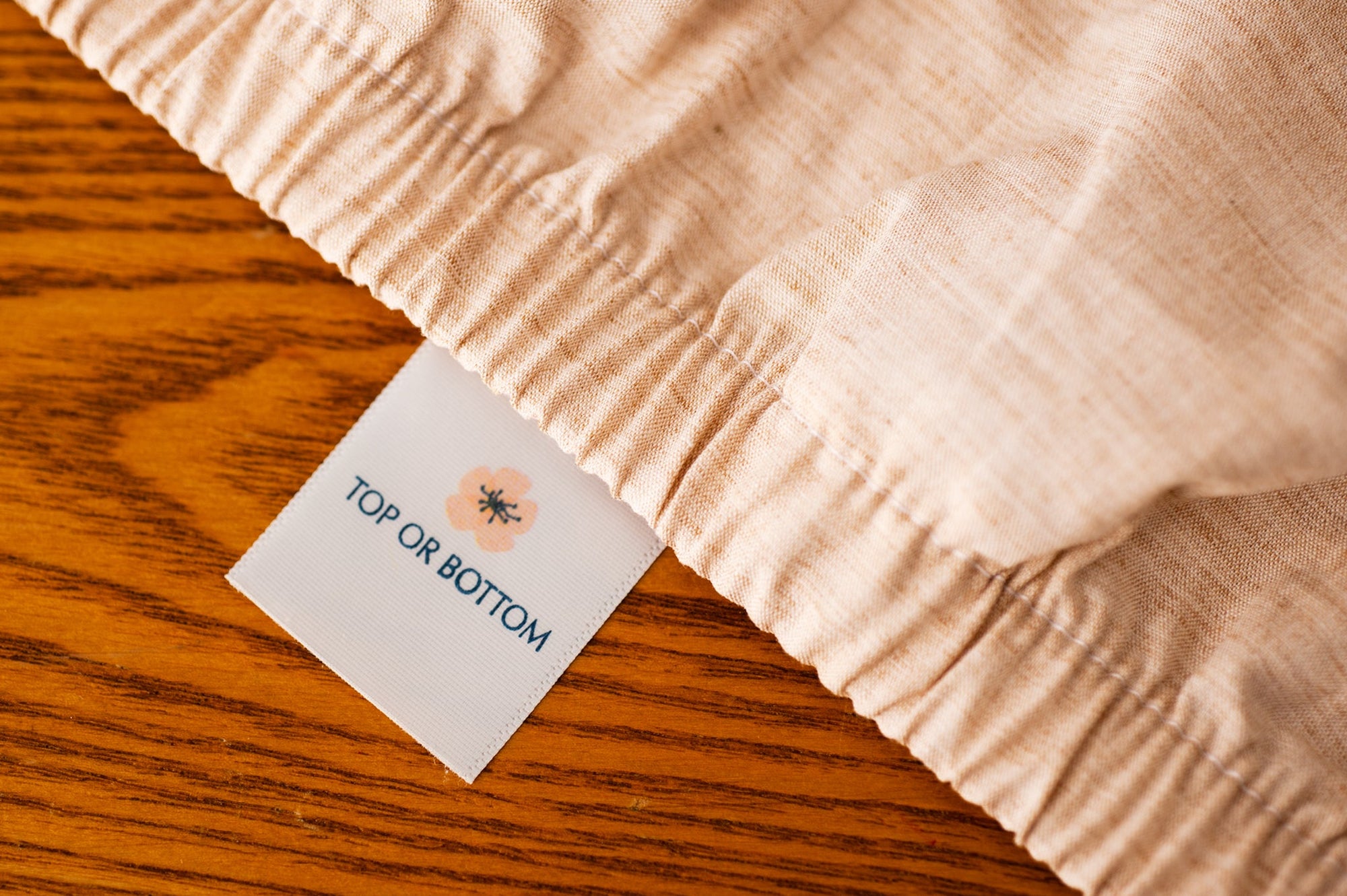 Organic Cotton Fitted Sheet showing American Blossom Linens Label.