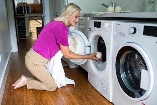 Woman at Dryer Reusable Dryer Ball Set Natural Wool Made in USA
